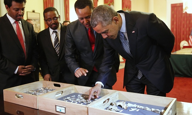 Pesident Obama touches the fossilized vertebra of Lucy, an early human ancestor in Ethiopia on Monday. Photograph: Jonathan Ernst/Reuters